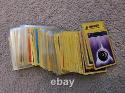 2.1k Damaged/HP VINTAGE Pokemon Card Lot with Holos, 1st Editions, Rares, and More