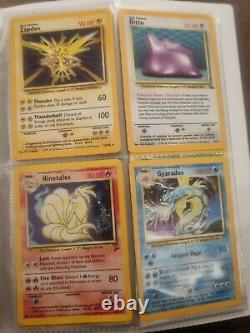 Base set Pokemon Cards. 1st Editions, holo's, charizard, rare. 215 cards. (Read)