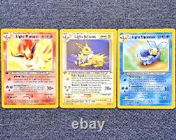 Cartes Pokémon 1ère Édition Ensemble de 3 : Jolteon Lumière, Flareon Lumière, Vaporeon Lumière