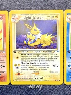 Cartes Pokémon 1ère Édition Ensemble de 3 : Jolteon Lumière, Flareon Lumière, Vaporeon Lumière