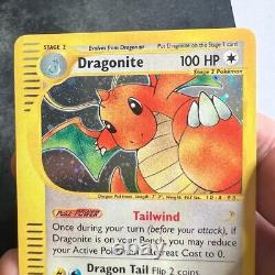 Dragonite 9/165 Expedition Base Set Holo Rare Pokemon Card Near Mint  
 <br/>
	<br/>
Traduction en français: Carte Pokemon rare Dragonite 9/165 de l'ensemble de base de l'expédition en Holo, en état presque neuf