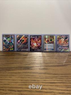 Ensemble complet de cartes Pokémon contenant un Shaymin Ex en or, un Charizard Vstar et plus encore